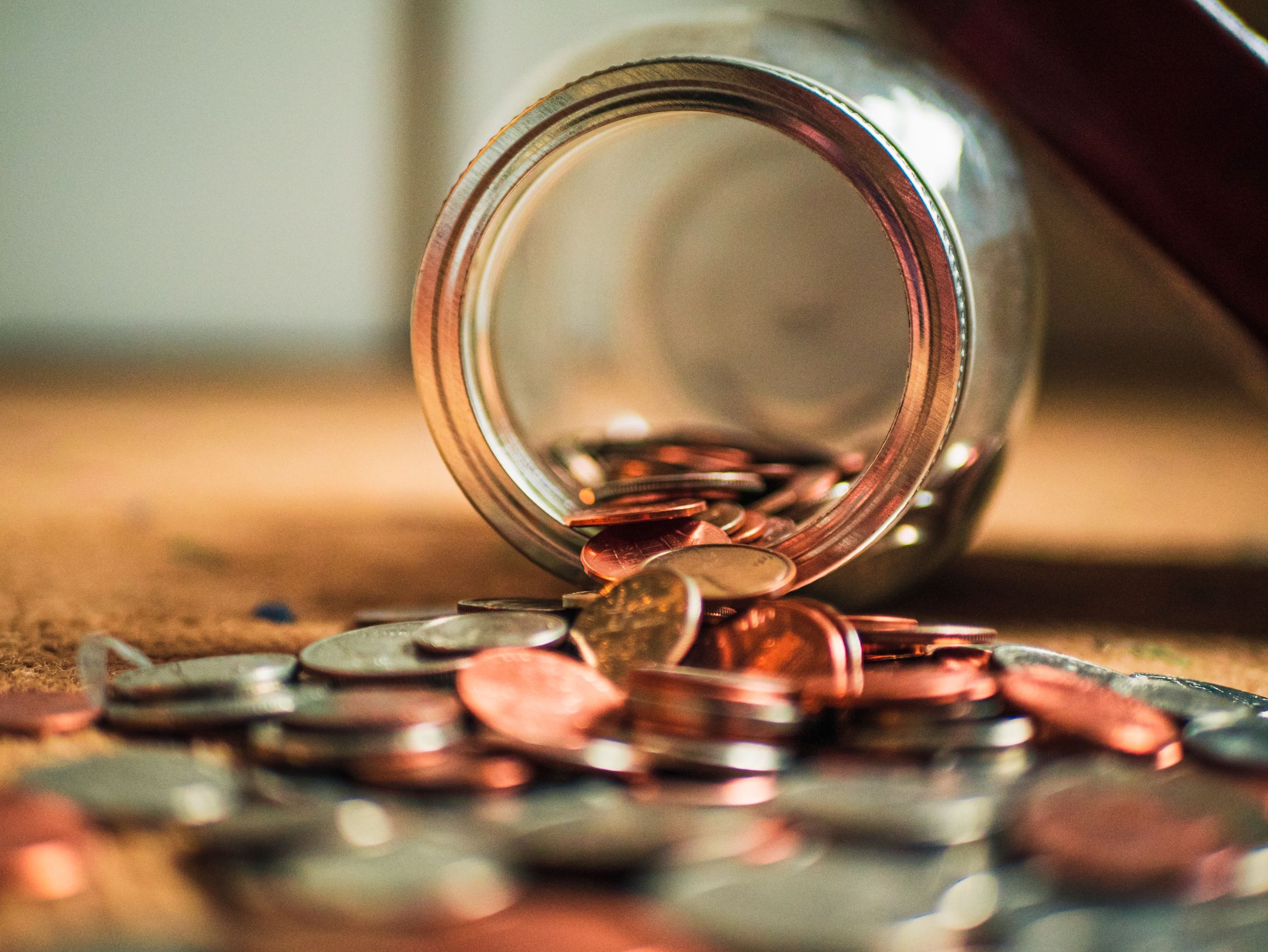 Pennies in a tipped jar. How has the Covid-19 pandemic affected credit management?